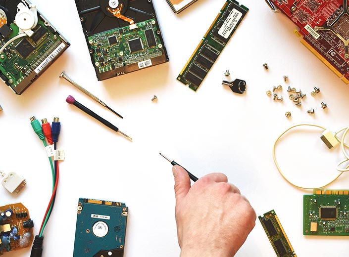 Components of a computer are laid out on a tabletop.